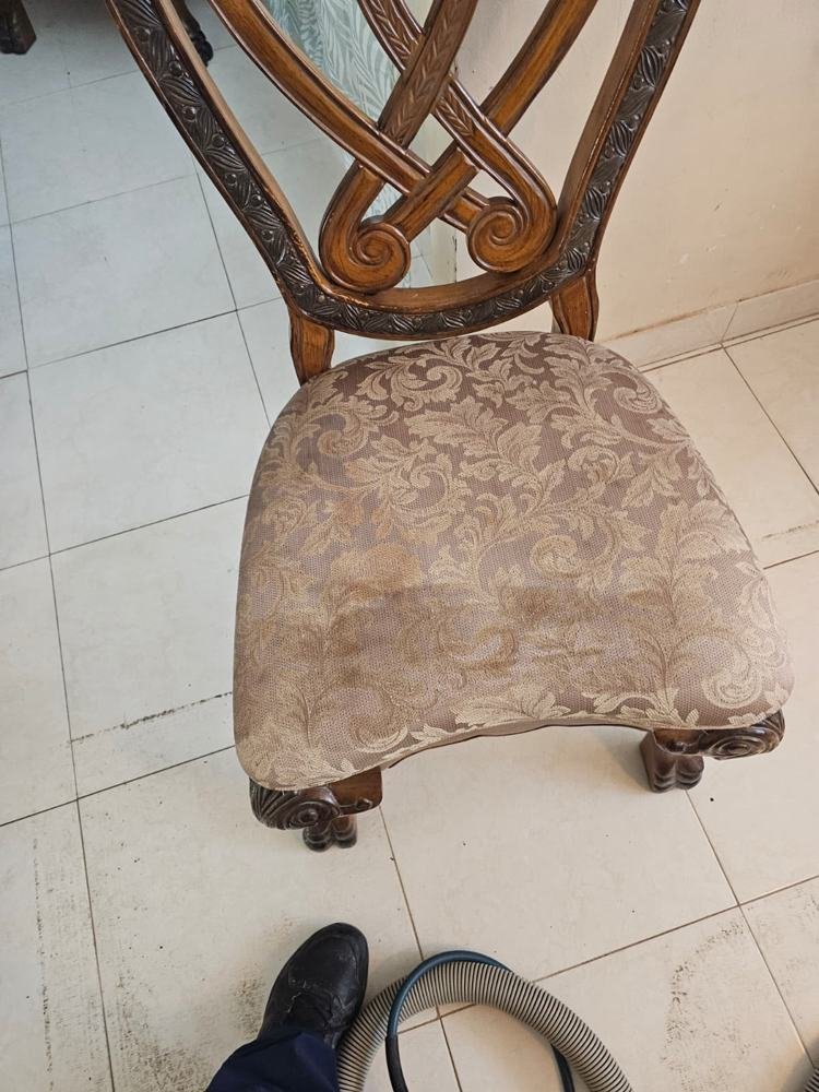 Antique dining chair seat during upholstery cleaning