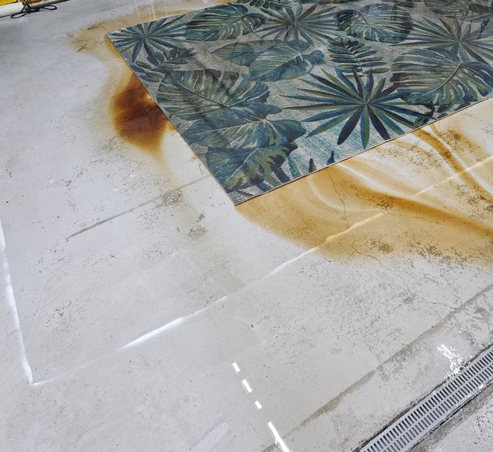 Area rug being washed on a rug cleaning floor