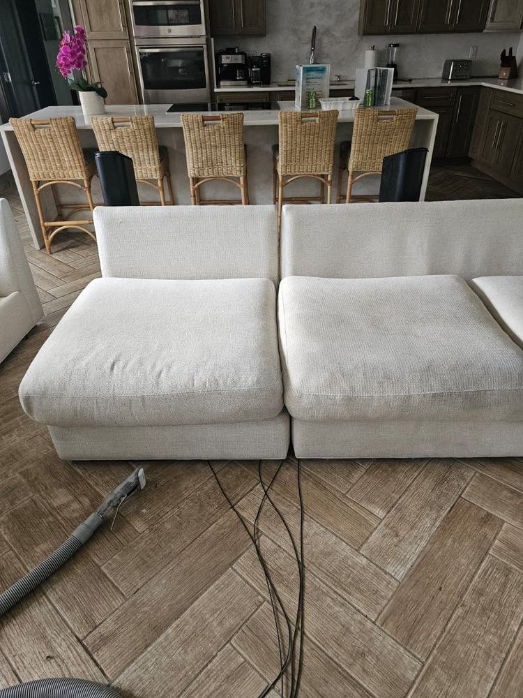 White sectional sofa during hot water extraction cleaning